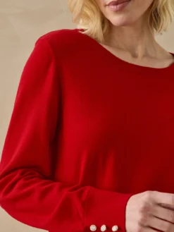 Pull boutons-bijoux aux manches